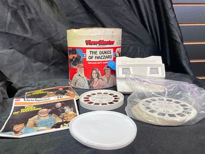 A Collection of View-Master 'The Dukes of Hazzard' Deluxe Gift Canister, Viewers, and Reels. A 