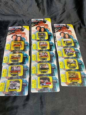 A Collection of Racing Champions 'The Dukes of Hazzard' 1/144 Scale Die-Cast Vehicles. A 