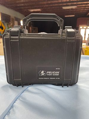 A Black Pelican 1120 Hard Case. A black Pelican 1120 hard case, measuring approximately 8.5 