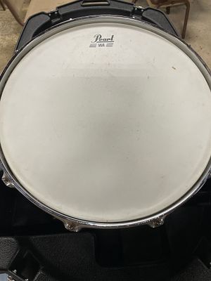 A Pearl Chrome/Metallic 14-inch Snare Drum with Case. A 14-inch chrome/metallic Pearl snare drum 