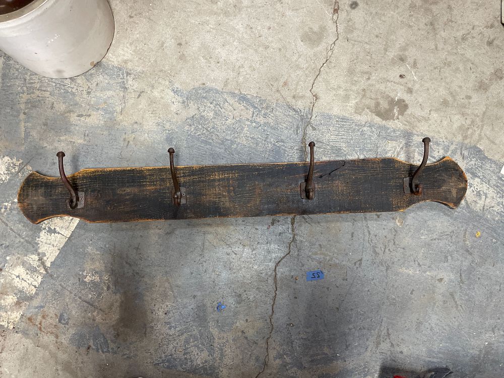 Lot 166: Rustic Wall-Mounted Coat Rack with Four Cast Iron Hooks