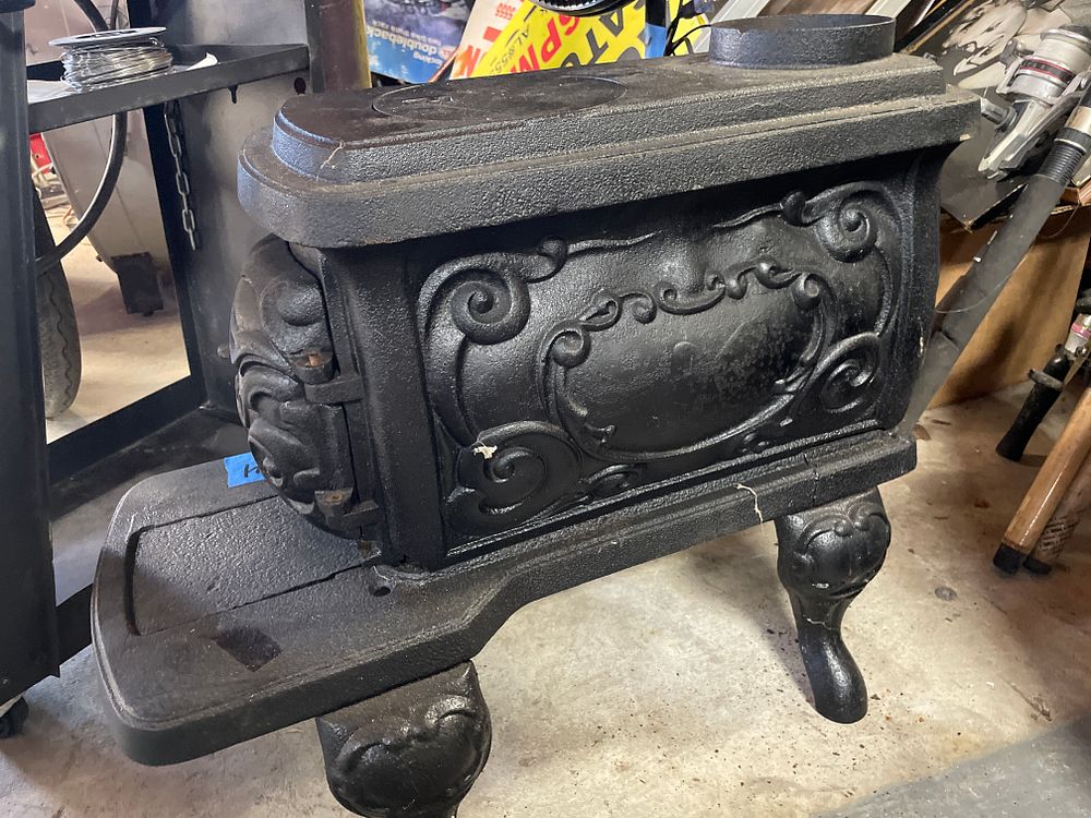 Lot 168: Antique Cast Iron Parlor Stove with Rococo Relief Decoration