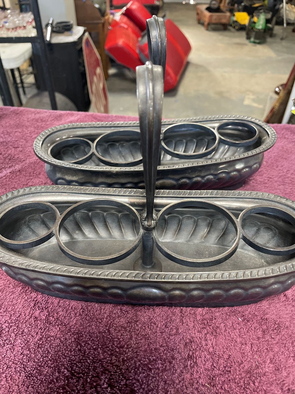 Lot 177: A Pair of Reed & Barton Silver Soldered Six-Bottle Cruet Carriers