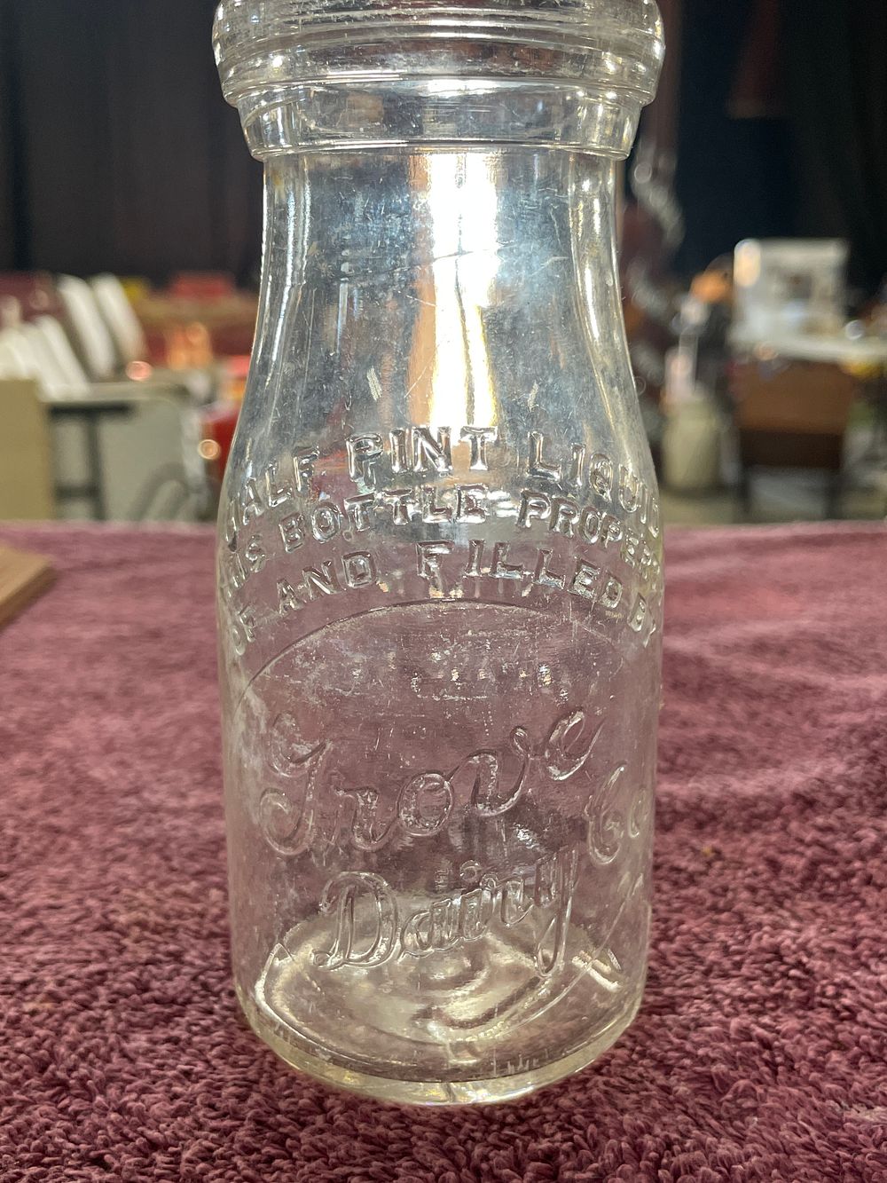 Lot 16: Antique Grove Dairy Co. Half Pint Embossed Glass Milk Bottle