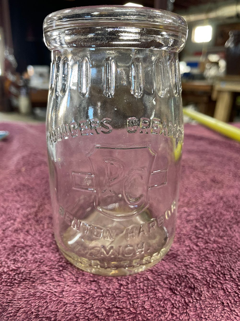 Lot 29: Vintage Producers Creamery 12 Oz. Embossed Clear Glass Dairy Jar Benton Harbor Mich.