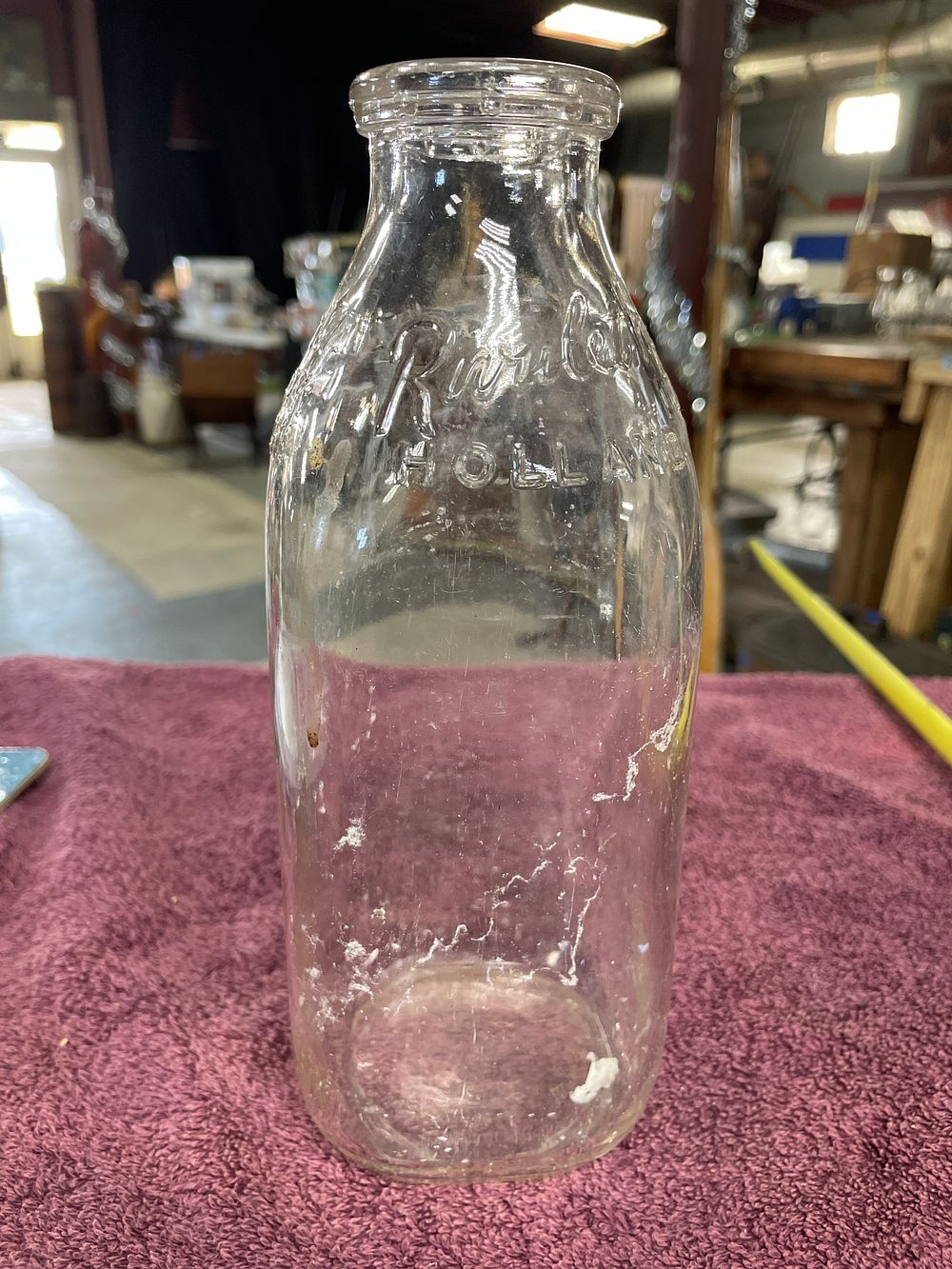 Lot 30: Vintage Embossed One Quart Milk Bottle for Purelet's Holland Dairy Michigan