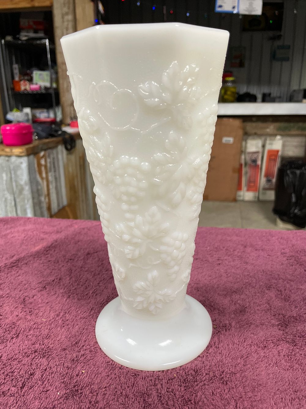 Lot 40: A Milk Glass Footed Vase with Grape and Foliage Relief Pattern