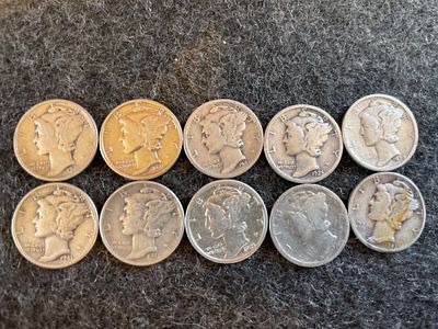 A Collection of United States Mercury Dimes. A collection of silver-colored United States 