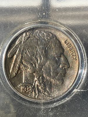 1936 Buffalo Nickel with Iridescent Toning. A silver-toned 1936 Buffalo nickel featuring 
