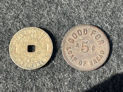 Two Mississippi Tax and Alabama Bread Trade Tokens. Two metal tokens including a Mississippi Tax 