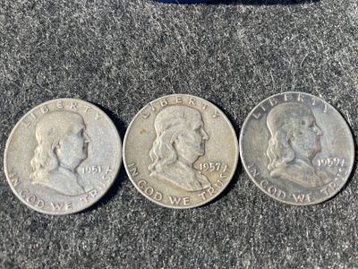 A Trio of Silver Franklin Half Dollars Dated 1951-1959. A trio of silver Franklin half dollars 