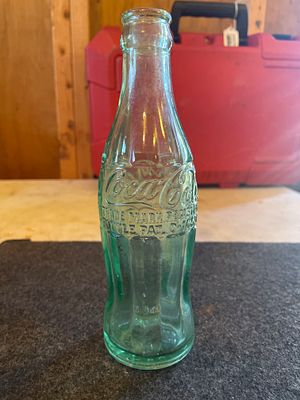 Coca-Cola Hobble Skirt Glass Bottle Frisco City Alabama. A light green glass Coca-Cola bottle 