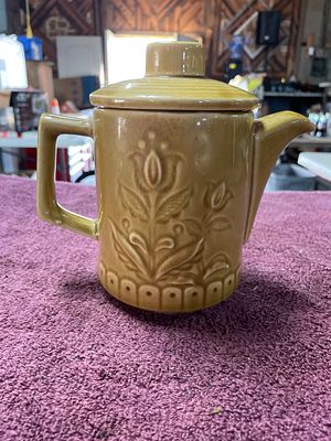 Vintage MCM Mustard Yellow Embossed Floral Ceramic Teapot Japan. A mustard-yellow ceramic teapot 