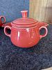 Fiesta Ceramic Cream and Sugar Set with Tray. A three-piece orange-red ceramic set featuring a Image - 1