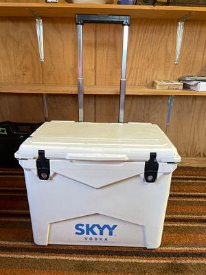 SKYY Vodka Branded White Rolling Cooler. A white rolling cooler featuring the SKYY Vodka logo 