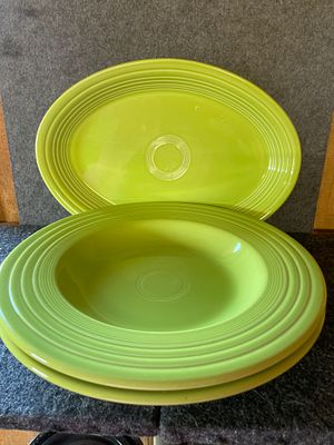 A Collection of Chartreuse Green Fiesta Ceramic Dishware. A collection of chartreuse green 