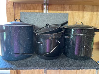 A Collection of Imusa Speckled Enamelware Cookware. A collection of dark blue and black speckled 