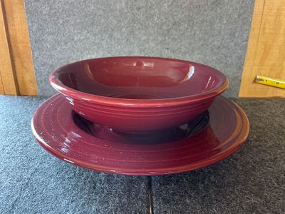 A Pair of Fiesta Maroon Ceramic Bowl and Shallow Dish. A pair of maroon ceramic Fiesta pieces 