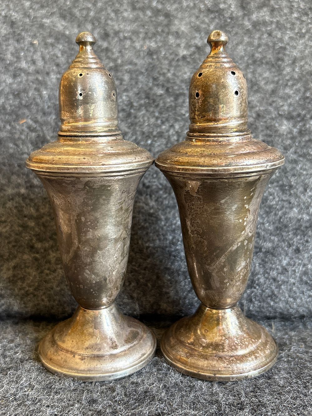 A Pair of Empire Sterling Silver Weighted Salt Pepper Shakers. A pair of Empire sterling silver 