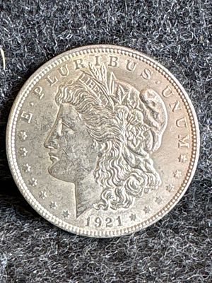 1921 United States Morgan Silver Dollar Coin. A 1921 silver-colored United States Morgan Silver 