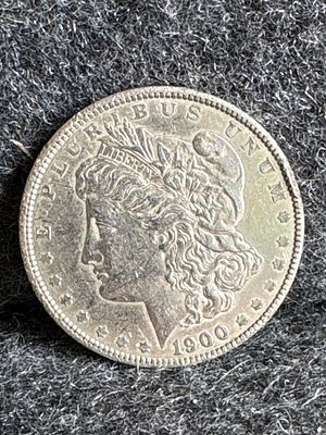 1900-O Morgan Silver Dollar Coin. A 1900 Morgan silver dollar coin featuring a silver finish and 