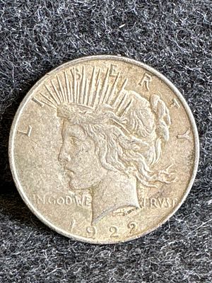 1922 Peace Silver Dollar Coin. A 1922 United States Peace silver dollar coin featuring Lady 