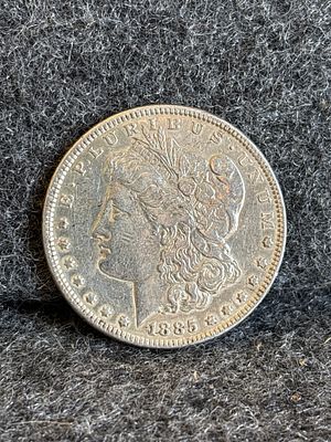 1885 United States Morgan Silver Dollar Coin. A silver 1885 United States Morgan dollar coin 