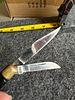 Pakistan Three-Blade Folding Pocket Knife with Brass Bolsters. A three-blade folding pocket Image - 1