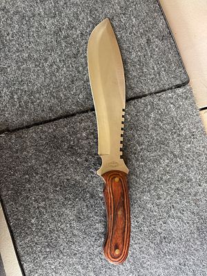 Frost Cutlery Fixed Blade Hunting Knife with Wood Handle. A Frost Cutlery fixed-blade knife with 