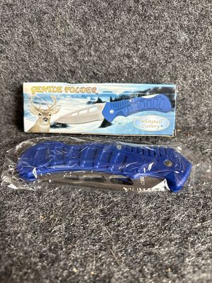 Two Folding Pocket Knives Including Whitetail Cutlery Gentle Folder. A collection of two folding 