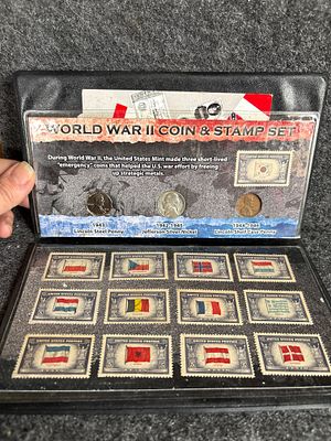 World War II Coin and Overrun Countries Stamp Set. A World War II Coin and Stamp Set in a black 
