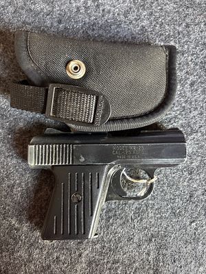 Raven Arms Model MP-25 .25 Caliber Pistol with Holster. A black Raven Arms Model MP-25 .25 