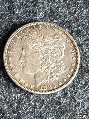 1880-S United States Morgan Silver Dollar. An 1880 United States Morgan silver dollar featuring 