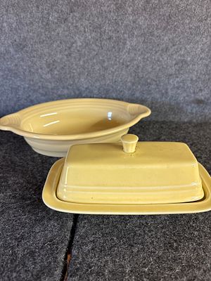 One lioght yellow and one tan Fiesta Ceramic Tableware Pieces. Fiestaware collection consisting 