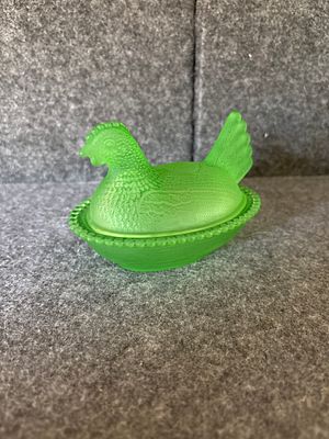 A Lime Green Frosted / satin Glass Hen on Nest Covered Dish Does NOT glow. This two-piece 