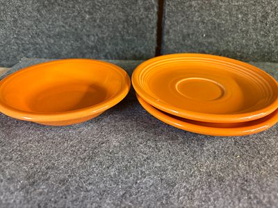 A Collection of Homer Laughlin Fiesta Tangerine Glazed Ceramic Tableware. A collection of 