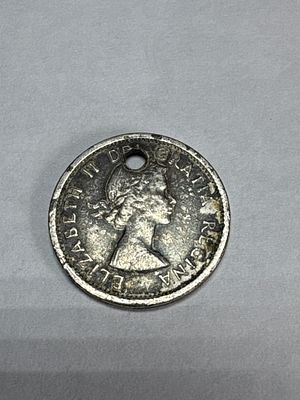 1964 CA 1-Cent Coin, Plated White Metal, Holed. This 1964 CA 1-cent coin is composed of a 