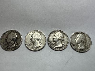 A Group of US Silver Washington Quarters. A group of US silver Washington quarters including 