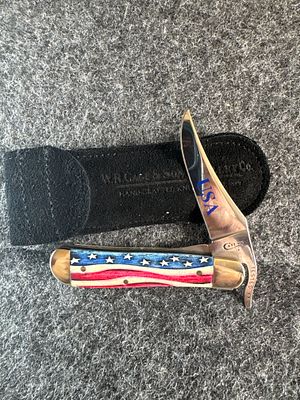 Case Star Spangled Embellished Smooth Bone Cheetah Swing-Guard Folding Knife. This folding 
