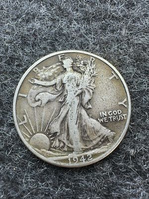 1942 US Walking Liberty Silver Half Dollar. This 1942 Walking Liberty half dollar was struck at 