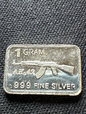1 Gram .999 Fine Silver Bullion Bar with AK-47 Rifle Motif. One fractional silver bullion bar 