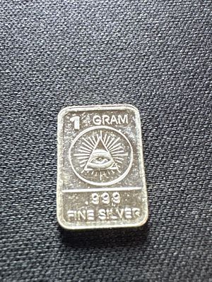 1 Gram .999 Fine Silver Bullion Bar with All- Seeing Eye Design. This lot features a single 