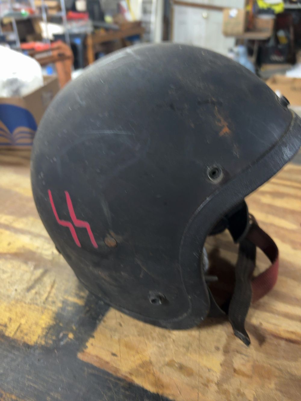 Lot 171: Vintage Open-Face Black Motorcycle Helmet with Hand-Applied Sig Runes