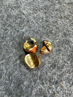 Three Pieces of 16k Scrap Gold-Tone Dental Crowns. This lot comprises three scrap dental crowns 