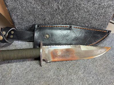 Bowie Style Sawback Survival Knife with Cord Wrapped Handle and Sheath. Fixed blade Bowie-style 