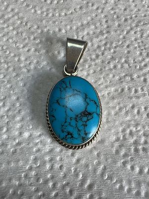 Mexican Sterling Silver and Turquoise Cabochon Pendant. A sterling silver pendant of Mexican 