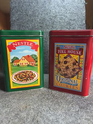 A Pair of Vintage Nestle Toll House Lithographed Advertising Tins. A pair of vintage collectible 