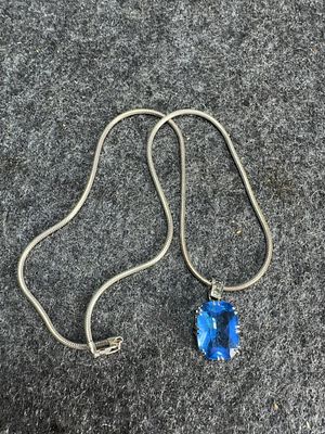 Sterling Silver and Faceted Blue Gemstone Pendant Necklace. A sterling silver necklace featuring 