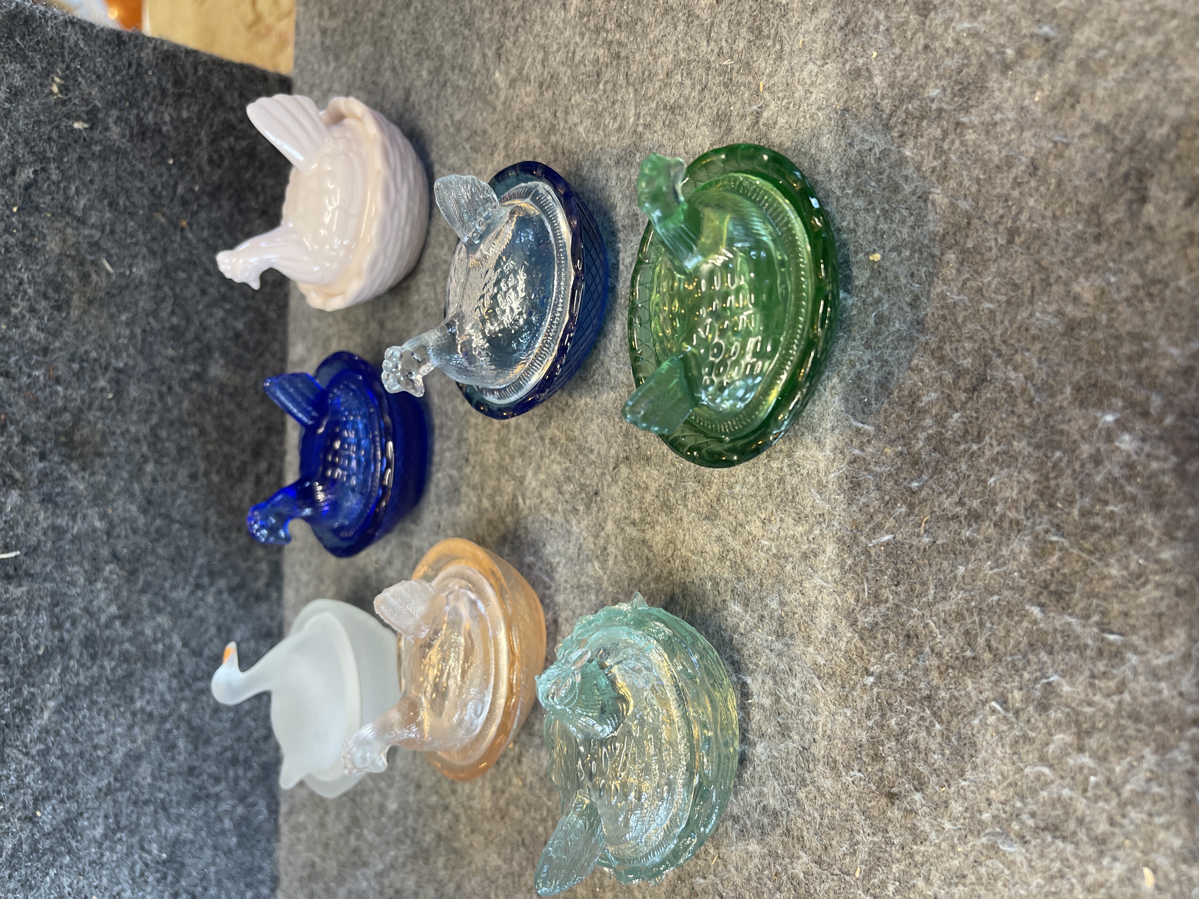 A Collection of Seven Miniature Glass Bird on Nest Salt Cellars
