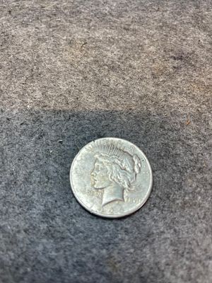 US 1926-S Silver Peace Dollar. This United States silver dollar is dated 1926 and features the S 